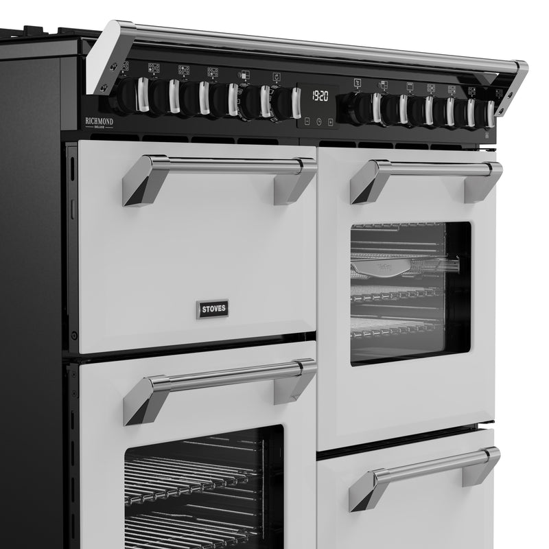 Ice white 100cm dual fuel range cooker with multiple ovens, chrome handles, and control knobs, Eastbourne Uckfield Free. - DB Domestics