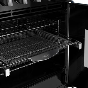 Open black oven interior with chrome wire mesh tray and multiple rack levels, Stoves Richmond Deluxe 100cm Dual Fuel cooker. - DB Domestics