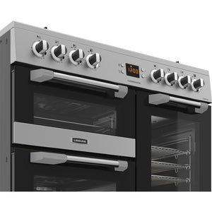 Stainless steel 90cm dual fuel range cooker with seven control knobs, digital display, and double oven doors, Eastbourne. - DB Domestics