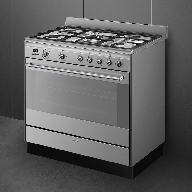 Stainless steel Smeg 90cm dual fuel range cooker with six gas burners and large oven, Eastbourne Uckfield Free Delivery. - DB Domestics