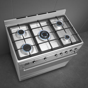 Smeg 90cm dual fuel range cooker in stainless steel with five burners, knobs, and cast iron pan supports, Free Delivery. - DB Domestics